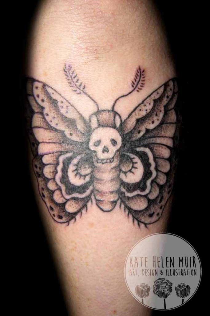 tattoo arm moth skull