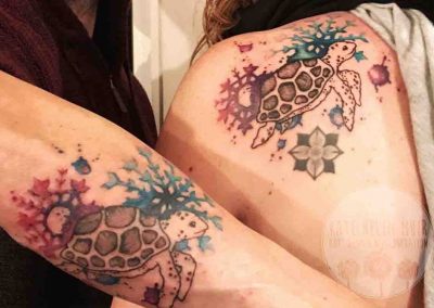Snowflakes and Turtle Watercolour Style Tattoo