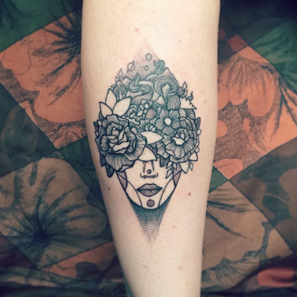 leg tattoo lady face flowers space